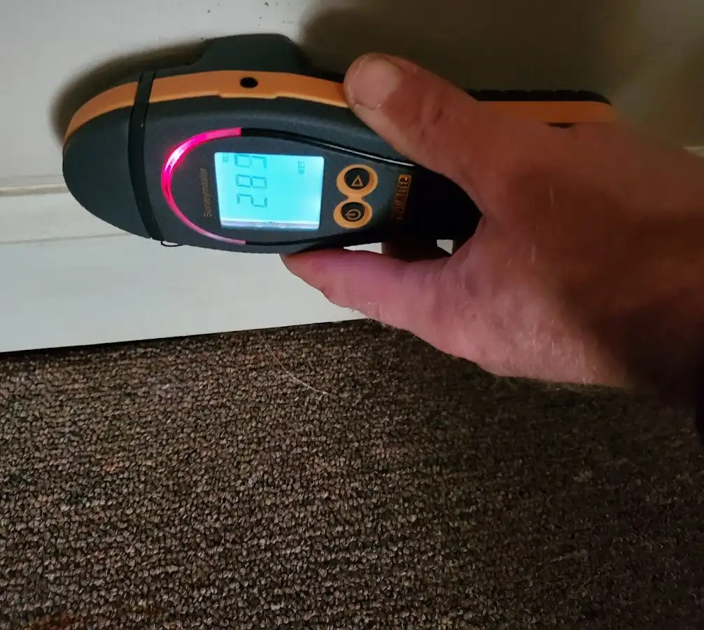 Moisture detection at baseboard during Storm Damage Restoration in Prairie Ridge